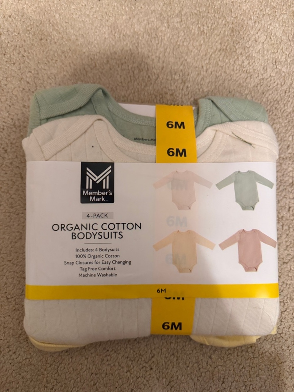 Member's Mark Organic Cotton 4-Pack Baby Bodysuits - Green, Cream, Yellow, Pink
